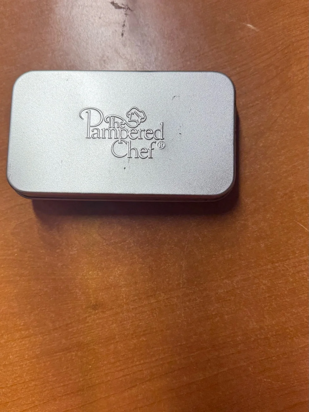 The Pampered Chef compact tin